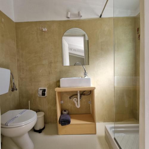 a bathroom with a toilet and a sink and a shower at athensvintage in Athens