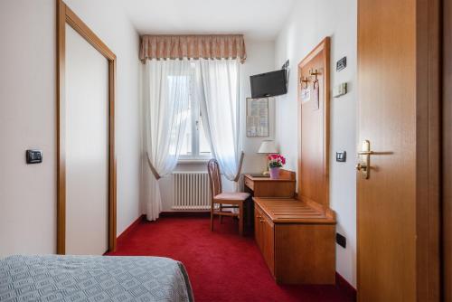 Postel nebo postele na pokoji v ubytování Hotel Lucia