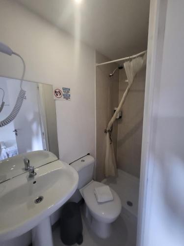 a bathroom with a sink and a toilet at What Else - Fatima in Fátima