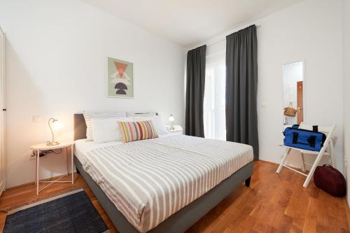 Postel nebo postele na pokoji v ubytování T&T Sea View Apartments
