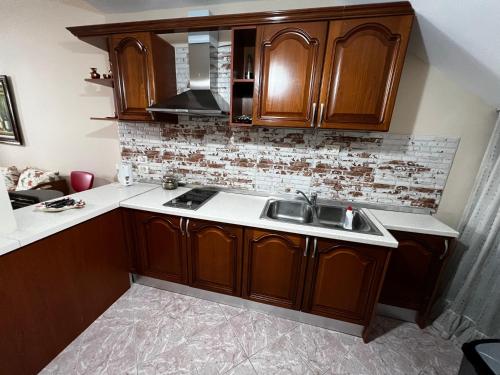 Η κουζίνα ή μικρή κουζίνα στο Grand Veranda Apartment