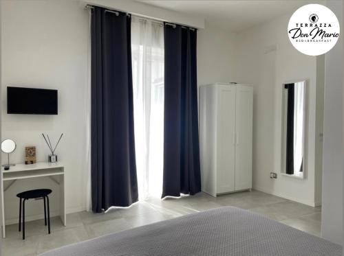 Ένα ή περισσότερα κρεβάτια σε δωμάτιο στο Terrazza Don Mario bed&breakfast