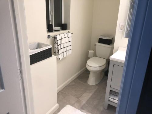a small bathroom with a toilet and a sink at VacaStay on Scandia Way in Los Angeles