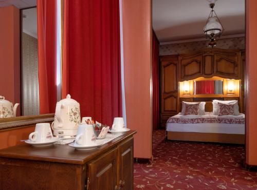 Ένα ή περισσότερα κρεβάτια σε δωμάτιο στο Real Hotel