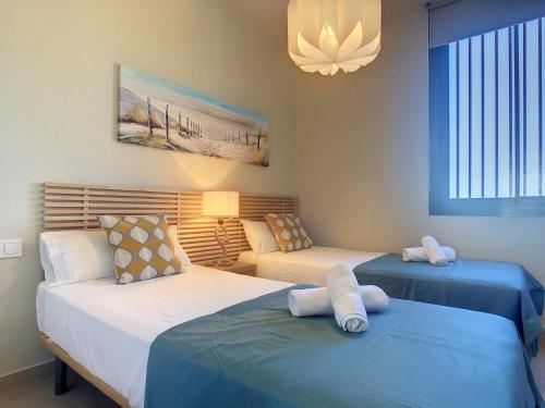 Postel nebo postele na pokoji v ubytování Antilia Terraces 3 Apartment -6309