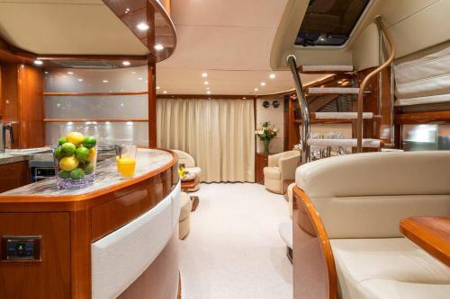 a kitchen and a living room in a yacht at Euphoria Luxury Yacht including Full Day Charter for up to12 guests in Parkstone