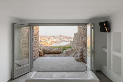 Ένα ή περισσότερα κρεβάτια σε δωμάτιο στο Villa Almi in Mykonos