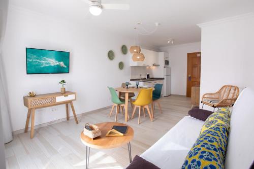 a living room with a couch and a table at ALTAVISTA APARTAHOTEL-Adults Only over 14 in Morro del Jable