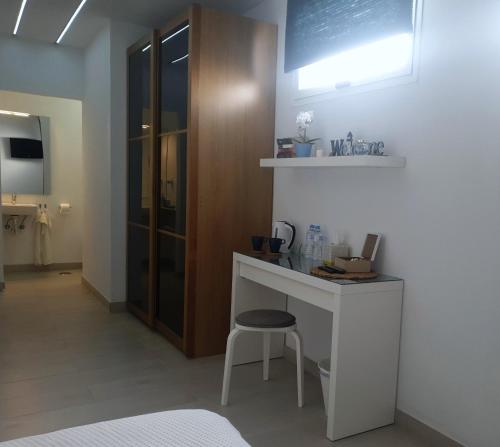 a room with a white desk and a chair at Paradise room near the beach in Playa Honda