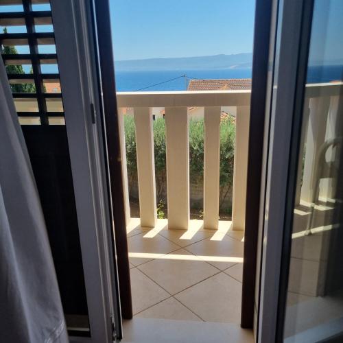 a view from a balcony with a view of the ocean at Villa Mila in Bol