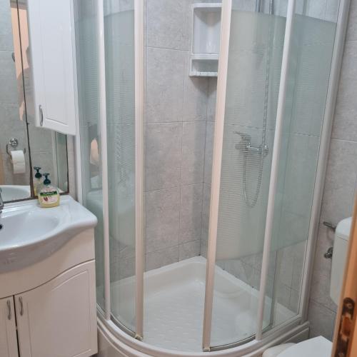 a shower with a glass door in a bathroom at Villa Mila in Bol