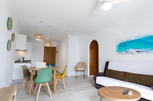 a living room with a couch and a table at ALTAVISTA APARTAHOTEL-Adults Only over 14 in Morro del Jable