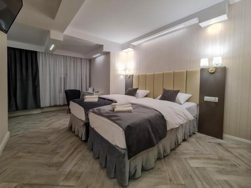 Ένα ή περισσότερα κρεβάτια σε δωμάτιο στο Apartamenty Hayduk