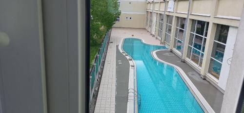 a view of a swimming pool from a building at Apartma Rogaska riviera in Rogaška Slatina