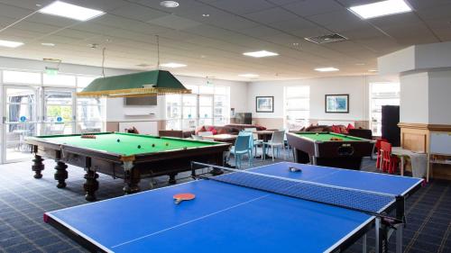 a billiard room with two pool tables in it at Eastwood Hall in Eastwood