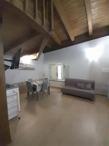 a living room with a couch and a table at Appartamenti Cryfani in Pizzo