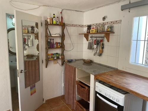 a small kitchen with a counter and a sink at retreat studio in Santa Eularia des Riu