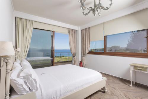 Postel nebo postele na pokoji v ubytování Villa D'Oro - Luxury Villas & Suites