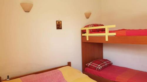 A bed or beds in a room at Apartament LEON Maleme do 6 os.