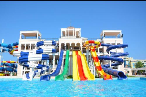 a water park with a water slide in the water at "Красавиците тъмнокоси" Sunset Resort Pomorie in Pomorie