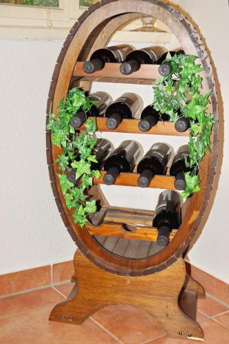 a wine rack with a bunch of wine bottles at Pension Webstuhl in Deizisau