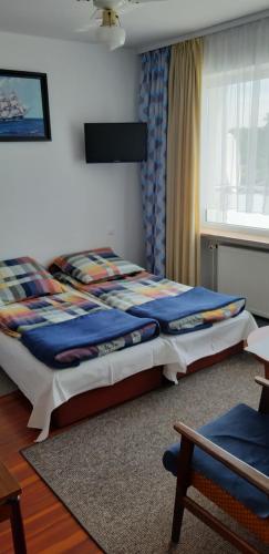 a bedroom with a large bed in a room at Międzyzdroje ul Nowomyśliwska 60 in Międzyzdroje