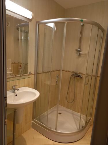a bathroom with a shower and a sink at Студио в комплекс Golden Beach, Sunny Beach in Sunny Beach