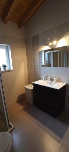 a bathroom with a sink and a toilet at Casa de campo a 5 minutos da praia in Atouguio