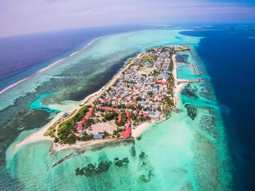 an aerial view of an island in the ocean at Stingray Beach Inn in Maafushi