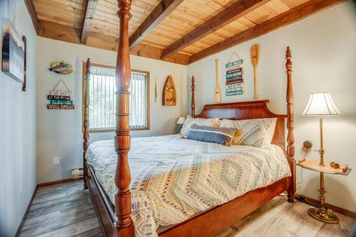 a bedroom with a wooden bed with a wooden ceiling at Elmwood Elmwood Escape A Cozy Retreat at The Hideout in Hamlin