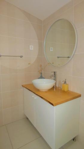 a bathroom with a sink and a mirror at Casa CÔA - Casas de Villar - Rural Experience in Vilar de Amargo