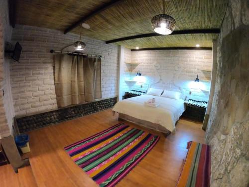 Postel nebo postele na pokoji v ubytování Hotel Rústico Casona de Sal