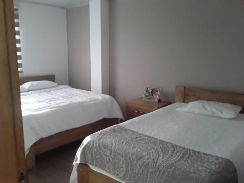 En eller flere senge i et værelse på Hotel Filigrana Mompox