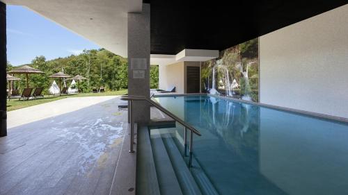 a swimming pool in a house at Aqua Village, Health Resort in Oliveira do Hospital