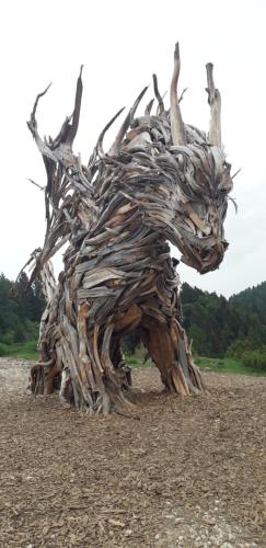 a sculpture of a horse made out of wood at Casetta Maia in Lavarone