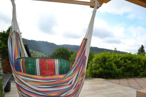 a colorful hammock sitting on top of a patio at Fichtenstüble in Todtmoos