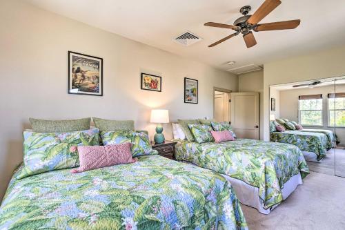 a bedroom with two beds and a ceiling fan at Sun-Soaked Waikoloa Retreat with Private Lanai! in Waikoloa