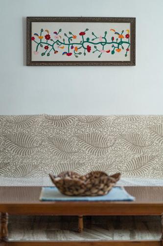 a bowl on a table in front of a couch at Cozy apartment in Sitia