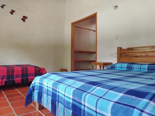 Llit o llits en una habitació de Hotel Ecoposada Viña de Aldana