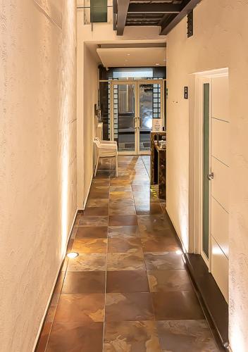 a hallway with a tiled floor in a house at Hotel Boutique Maria in Morelia