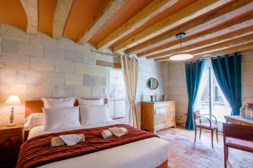 Llit o llits en una habitació de La Bohal' Loire