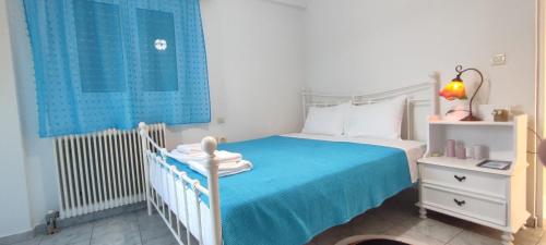 Postel nebo postele na pokoji v ubytování Thanasis' apartments Α2