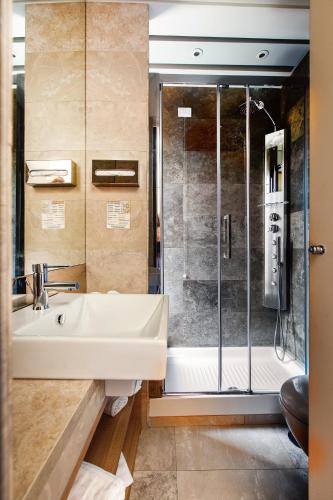 a bathroom with a sink and a shower at Hotel Smeraldo in Rome