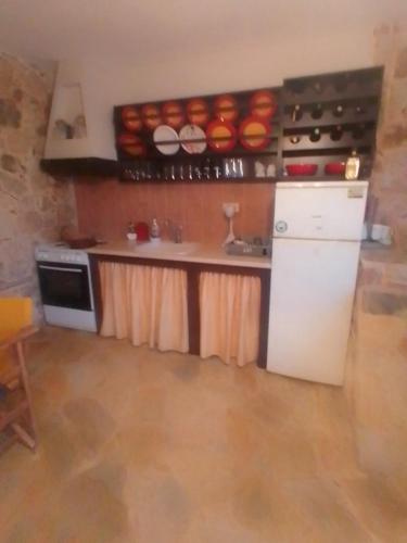 Kuchyň nebo kuchyňský kout v ubytování Thodis villa's
