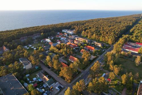 an aerial view of a small town next to the ocean at Ośrodek Wypoczynkowy Merkury in Mrzeżyno