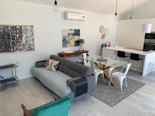 a living room with a couch and a table at Casa Pitta Charm Villa in Santarém