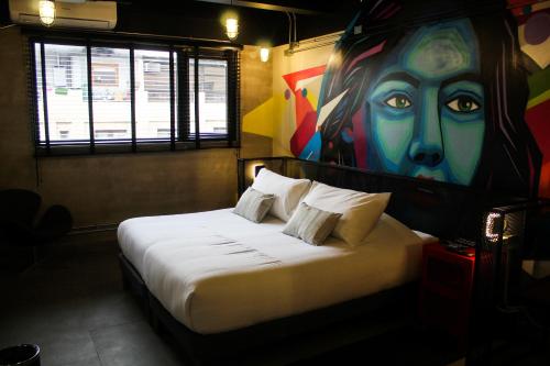 Postel nebo postele na pokoji v ubytování LOFT Hotel by Sommelier Hoteles
