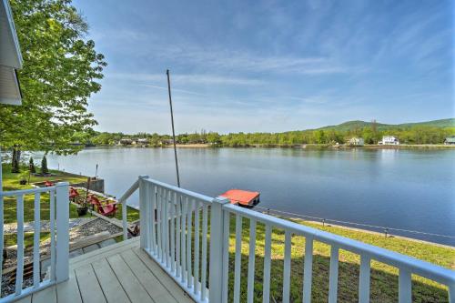 a porch with a view of a lake at Lake Luzerne Home with Fire Pit on Hudson River in Lake Luzerne