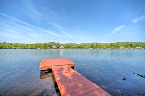 a dock in the middle of a lake at Lake Luzerne Home with Fire Pit on Hudson River in Lake Luzerne
