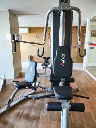 a gym with three exercise bikes in a room at Ramada by Wyndham Brasilia Alvorada in Brasilia